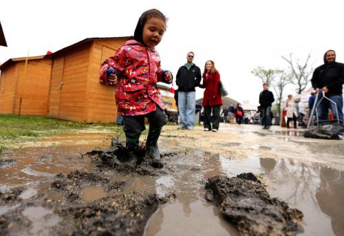 Dante Lorde, 2, plays in a mud puddle at the St. Norbert Farmers Market on its opening day of the season, Saturday, June 1, 2013. (TREVOR HAGAN/WINNIPEG FREE PRESS)
