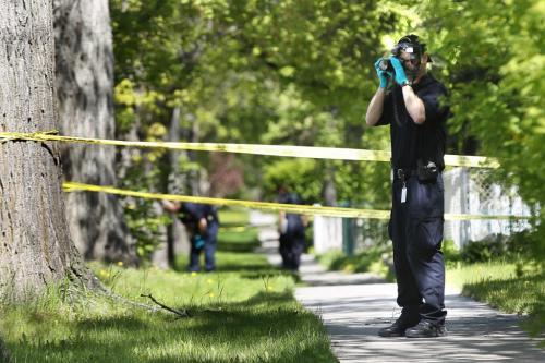 June 2, 2013 - 130602  -  Identification officers work the suspicious death scene on Dumoulin Street Sunday, June 2, 2013. John Woods / Winnipeg Free Press