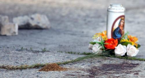 A memorial was set up including a candle, tobacco and sweet grass Monday morning near blood stains on the parking lot behind a building at Rue Dumoulin and Rue St. Joseph, across the street of the St. Boniface Hotel.   (WAYNE GLOWACKI/WINNIPEG FREE PRESS) Winnipeg Free Press June 3 2013