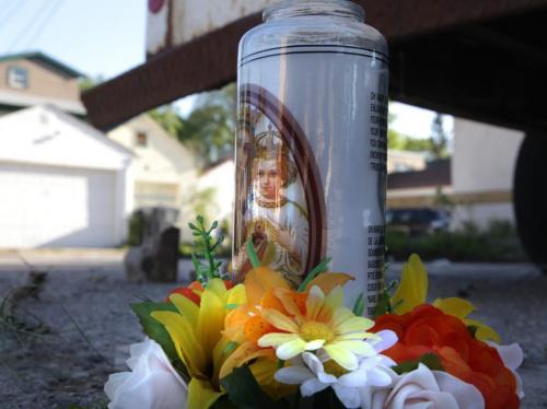 A memorial was set up including a candle, tobacco and sweet grass Monday morning near blood stains on the parking lot behind a building at Rue Dumoulin and Rue St. Joseph, across the street of the St. Boniface Hotel.   (WAYNE GLOWACKI/WINNIPEG FREE PRESS) Winnipeg Free Press June 3 2013