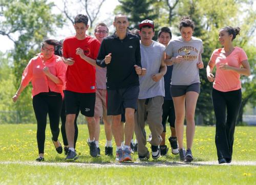 MLA Kevin Chief is training with some youth that will be running the Manitoba Marathon. Photo taken in St. John's Park. May 31, 2013  BORIS MINKEVICH / WINNIPEG FREE PRESS