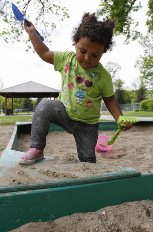 Eight-month-old Hailey Curtis took to the sandbox in St. John's Park on Monday, June 3, 2013, as afternoon temperatures pushed the mercury to 20 degrees Celsius. (JESSICA BURTNICK/WINNIPEG FREE PRESS)