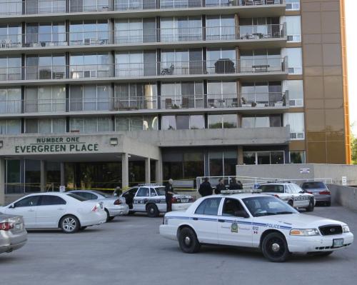 Winnipeg Police at a taped off scene in front of Number one Evergreen Place Wednesday morning.(WAYNE GLOWACKI/WINNIPEG FREE PRESS) Winnipeg Free Press June 5 2013