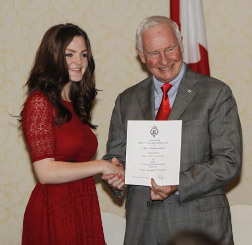 Laura Sutherland accepts The Duke of Edinburgh's Gold Award of Achievement from Governor General of Canada David Johnston. Twenty five young people were presented the award at a ceremony at the Fairmont Hotel in downtown Winnipeg on Wednesday, June 5, 2013. The award, available to youth between 14-25 years of age, is presented based on an individual's contributions and involvement in community service, physical recreation, skill development and adventurous journey. (JESSICA BURTNICK/WINNIPEG FREE PRESS)