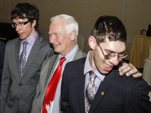Twenty five young people were awarded The Duke of Edinburgh's Gold Award of Achievement at a ceremony at the Fairmont Hotel in downtown Winnipeg on Wednesday, June 5, 2013. Recipients Stephen Rozniatowski (left) and Micah Kraut (right) are all smiles after the ceremony when they had the chance to mingle with Governor General of Canada David Johnston (centre). The award, available to youth between 14-25 years of age, is presented based on an individual's contributions and involvement in community service, physical recreation, skill development and adventurous journey. (JESSICA BURTNICK/WINNIPEG FREE PRESS)