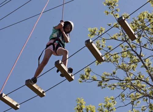 Tyndall Park Community School  student Juliana  VALDORIA  is attending Y Camp Douglas  summer camp  in Warren , she is taking part in a Giant Steps climbing activity that has her waking on a rope ladder 40ft above the ground. Other events include bike riding and swimming .reporter nick martin story on students KEN GIGLIOTTI / JUNE 6 2013 / WINNIPEG FREE PRESS