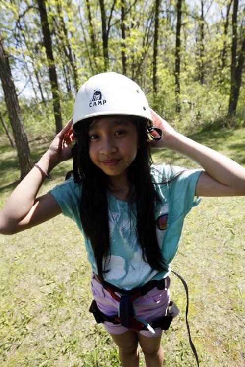 Tyndall Park Community School  student Juliana  VALDORIA  is attending Y Camp Douglas  summer camp  in Warren , she is taking part in a Giant Steps climbing activity that has her waking on a rope ladder 40ft above the ground. Other events include bike riding and swimming .reporter nick martin story on students KEN GIGLIOTTI / JUNE 6 2013 / WINNIPEG FREE PRESS