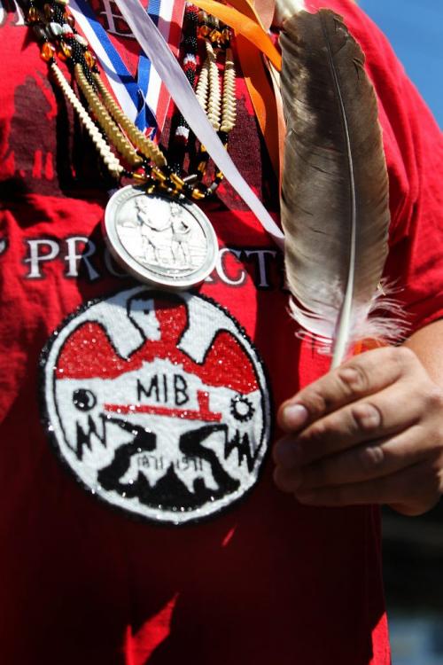 The  Assembly of Manitoba Chiefs (AMC) Grand Chief Derek Nepinak, holds a eagle feather as he talks to the media during during a press conference at Swan Lake Gas Station in Headingley Thursday afternoon. Nepinak discussed his Treaty Freedom Caravan/Ride" which started in the morning and will continue across Treaty 1, 2,4,5,6 and 7 Territories before returning to Treaty 1 territory.  See Ashley Prest story. Photography by Ruth Bonneville Winnipeg Free Press June 05, 2013