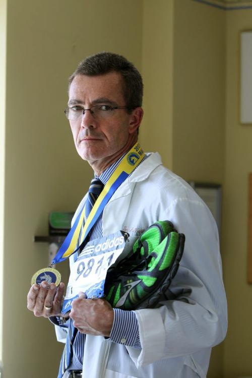Dr. Tim McCarthy who ran the Boston Marathon this year  -  the story touches on how it was hard to return to normal after the bombing. Various portraits of McCarthy with his medal, bib, runners that he used in race. See Melissa Martin story. Photography by Ruth Bonneville Winnipeg Free Press June 06, 2013