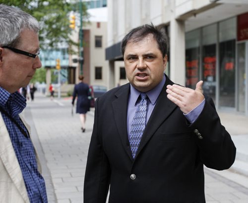 Winnipeg resident Richard Hykawy met with the media outside the provincial court at 373 Broadway on Friday, June 7, 2013, after the trial into the care of the boulevard bordering his property was adjourned. (ALDO SANTIN) (JESSICA BURTNICK/WINNIPEG FREE PRESS)