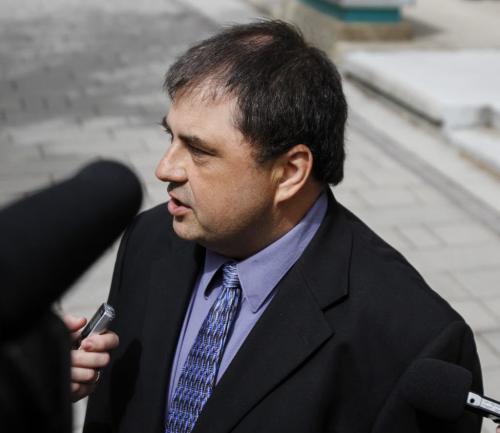 Winnipeg resident Richard Hykawy met with the media outside the provincial court at 373 Broadway on Friday, June 7, 2013, after the trial into the care of the boulevard bordering his property was adjourned. (ALDO SANTIN) (JESSICA BURTNICK/WINNIPEG FREE PRESS)
