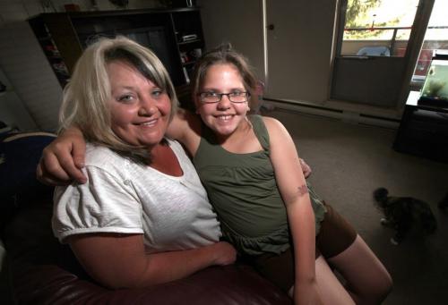 Stacy Ascoli poses at her EK Home with her daughter Racheal Holland who's going to camp compliments of the Sunshine Fund. June 7, 2013 - (Phil Hossack / Winnipeg Free Press)