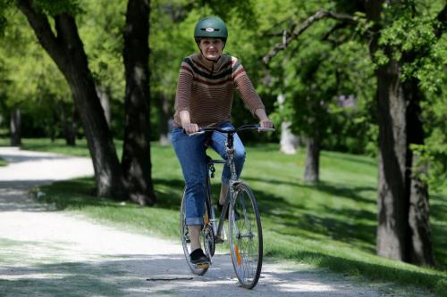 Joan Thomas, a novelist, in her favourite place in the city, the bikes paths through Point Douglas near the Norquay Community Centre, Thursday, June 6, 2013. (TREVOR HAGAN/WINNIPEG FREE PRESS) - Our Winnipeg