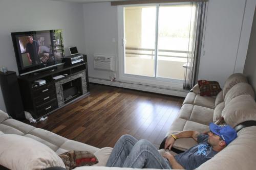 Twenty six year old Chad Ell is a first-time home buyer - he bought a one-bedroom condo on Beliveau Rd. and is now moved in. He's pictured here in his new condo on Friday, June 7, 2013. (MCNEILL) (JESSICA BURTNICK/WINNIPEG FREE PRESS)
