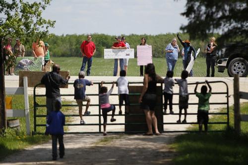 June 8, 2013 - 130608  - Friends and supporters of Arrayl Mason, owner of Aesgard Ranch, face off with protestors at her horse ranch Saturday June 8, 2013. A group gathered in front of Aesgard Ranch on highway 8 Saturday, June 8, 2013 in response to alleged animal abuse. John Woods / Winnipeg Free Press