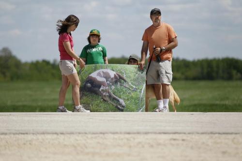June 8, 2013 - 130608  - A young family gathered with a group in front of Aesgard Ranch on highway 8 Saturday, June 8, 2013 in response to alleged animal abuse. John Woods / Winnipeg Free Press
