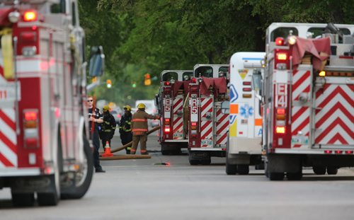 Firefighters and paramedics on the scene of a fire in an apartment building on the 400 block of Maryland Street, Saturday, June 8, 2013. (TREVOR HAGAN/WINNIPEG FREE PRESS)