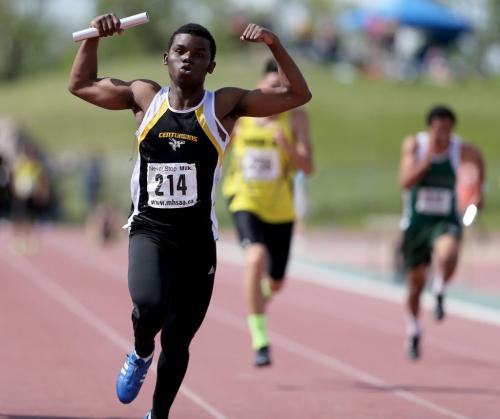 A participant in the 4x100 relay flexes for the camera as his team wins the final at the Milk Provincial Track and Field Championships at the University of Manitoba, Saturday, June 8, 2013. (TREVOR HAGAN/WINNIPEG FREE PRESS) - for kyle jahns story