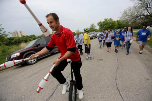 Juggler Robin Chestnut riding his unicycle during the Walk for Miracles which supports the ChildrenÄôs Hospital Foundation of Manitoba, Sunday, June 9, 2013. (TREVOR HAGAN/WINNIPEG FREE PRESS) for ashley prest 49.8