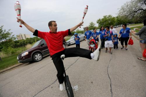 Juggler Robin Chestnut riding his unicycle during the Walk for Miracles which supports the ChildrenÄôs Hospital Foundation of Manitoba, Sunday, June 9, 2013. (TREVOR HAGAN/WINNIPEG FREE PRESS) for ashley prest 49.8