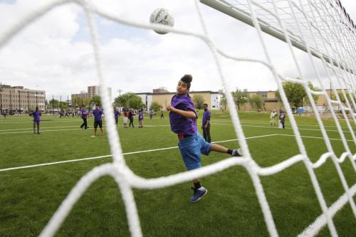 Gordon Bell High School student  Mohamad Elhalloufi plays goalie in a pick up soccer game  Monday morning after the official opening of the Gordon Bell High School Greenspace along Portage Ave.  Oliver Sachgau's  story.(WAYNE GLOWACKI/WINNIPEG FREE PRESS) Winnipeg Free Press June 10 2013