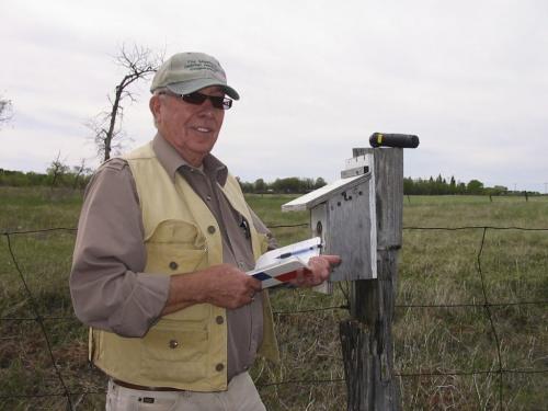 Herb Goulden, a Brandon Friends of Bluebirds member, records findings from one of his 45 bluebird boxes. June 3 2013. Bill Redekop story / photo. Winnipeg Free Press.