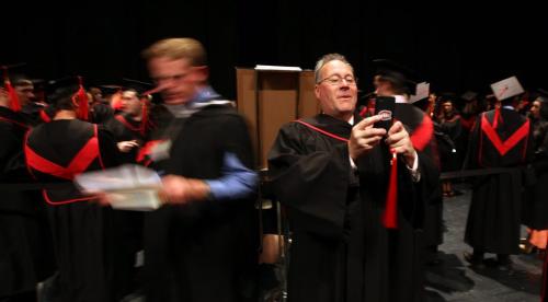 Bob Zado snaps a quick shot of some of his classroom buddies as they prepped to graduate from Commerce and Industry Sales and Marketing Monday night t the Concert Hall. See Nick Martin story.  June 10, 2013 - (Phil Hossack / Winnipeg Free Press)