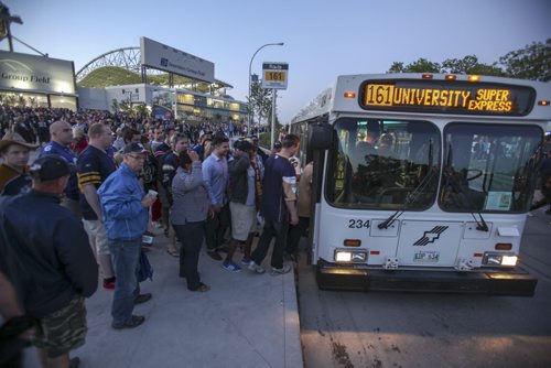 Bombers fans pile onto buses at the conclusion of the inaugural Winnipeg Blue Bombers game at the new Investors Field Stadium, which was played against the Toronto Argonauts on Wednesday, June 12, 2013. (JESSICA BURTNICK/WINNIPEG FREE PRESS) Transit