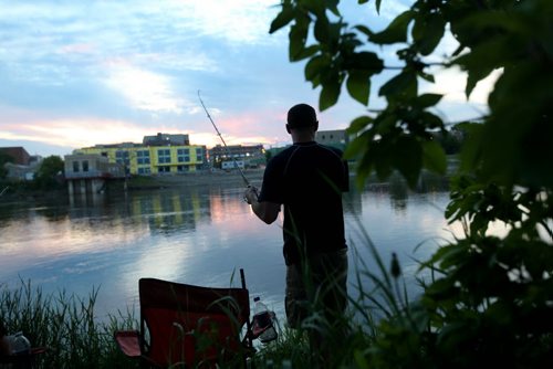 David Sylvestre  enjoys an evening fishing on the Red River near Whittier Park Thursday. Standup photo. Photography by Ruth Bonneville Winnipeg Free Press June 13,, 2013