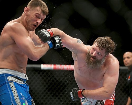 Roy Nelson, right, lands a heavy right on Stipe Miocic, during their heavyweight bout at UFC 161 in Winnipeg, Manitoba, Saturday, June 15, 2013. (TREVOR HAGAN/WINNIPEG FREE PRESS)