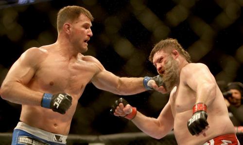 Stipe Miocic hits Roy Nelson during their heavyweight bout at UFC 161 in Winnipeg, Manitoba, Saturday, June 15, 2013. (TREVOR HAGAN/WINNIPEG FREE PRESS)