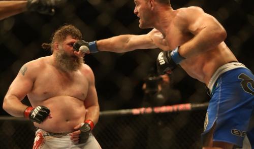 Stipe Miocic, right, hits Roy Nelson during their heavyweight bout at UFC 161 in Winnipeg, Manitoba, Saturday, June 15, 2013. (TREVOR HAGAN/WINNIPEG FREE PRESS)