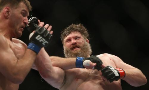 Roy Nelson, right, lands a heavy right on Stipe Miocic, during their heavyweight bout at UFC 161 in Winnipeg, Manitoba, Saturday, June 15, 2013. (TREVOR HAGAN/WINNIPEG FREE PRESS)