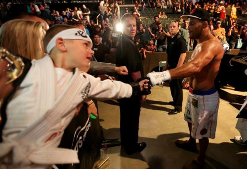 Dan Henderson takes a minute to meet with Avery Kelleher, 6, from Belleville, Ontario, following Henderson's loss to Rashad Evans at UFC 161 in Winnipeg, Manitoba, Saturday, June 15, 2013. (TREVOR HAGAN/WINNIPEG FREE PRESS)