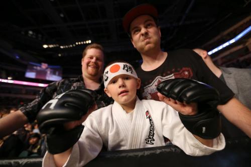 Avery Kelleher, 6, from Belleville, Ontario, with Robert Doxtaror, his Godfather, right, at UFC 161 in Winnipeg, Manitoba, Saturday, June 15, 2013. (TREVOR HAGAN/WINNIPEG FREE PRESS)