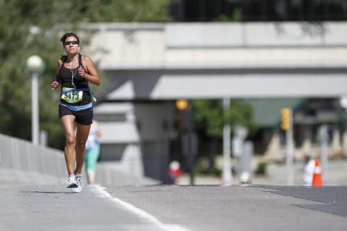 A runner pushes on towards the Mile 18 marker during the Manitoba Marathon in Winnipeg on Sunday, June 16, 2013. (JESSICA BURTNICK/WINNIPEG FREE PRESS)