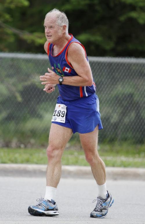 A runner slogs through Mile 24 of the Manitoba Marathon in Winnipeg on Sunday, June 16, 2013. (JESSICA BURTNICK/WINNIPEG FREE PRESS)