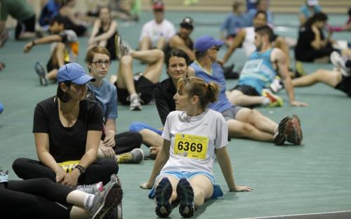 Runners stretch and get warmed up inside the Field House at the University of Manitoba prior to the 35th Annual Manitoba Marathon, Sunday, June 16, 2013. (TREVOR HAGAN/WINNIPEG FREE PRESS)