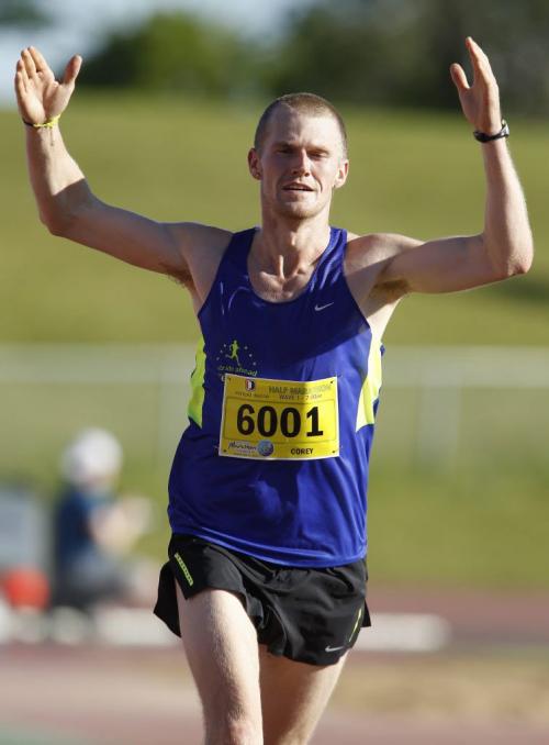 Corey Gallagher, half marathon winner, nears the finish line at the University of Manitoba during the 35th Annual Manitoba Marathon, Sunday, June 16, 2013. (TREVOR HAGAN/WINNIPEG FREE PRESS)