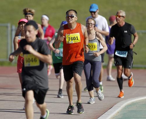 Participants near the finish line at the University of Manitoba during the 35th Annual Manitoba Marathon, Sunday, June 16, 2013. (TREVOR HAGAN/WINNIPEG FREE PRESS)