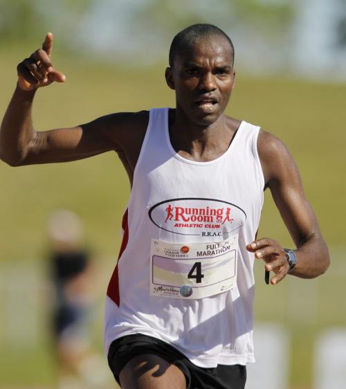 Evans Maiko, from Kenya, full marathon winner, nears the finish line at the University of Manitoba during the 35th Annual Manitoba Marathon, Sunday, June 16, 2013. (TREVOR HAGAN/WINNIPEG FREE PRESS)
