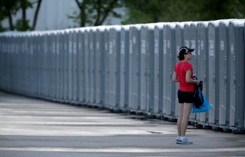 A marathon participant waits for portable bathroom near the start line at the University of Manitoba around 6am prior to the 35th Annual Manitoba Marathon, Sunday, June 16, 2013. (TREVOR HAGAN/WINNIPEG FREE PRESS)