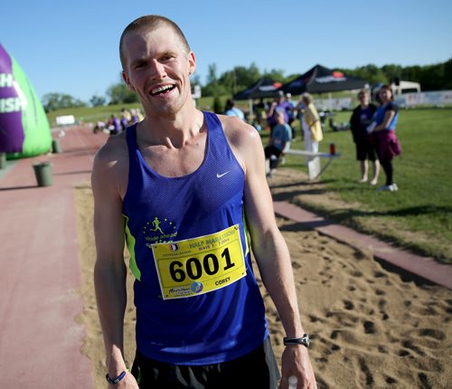 Corey Gallagher, half marathon winner, shortly after crossing the finish line at the University of Manitoba during the 35th Annual Manitoba Marathon, Sunday, June 16, 2013. (TREVOR HAGAN/WINNIPEG FREE PRESS)