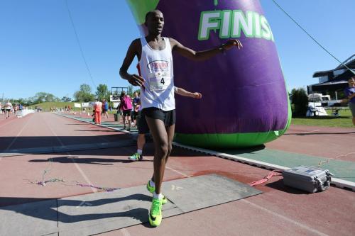 Evans Maiko, of Kenya, marathon winner, crossing the finish line at the University of Manitoba during the 35th Annual Manitoba Marathon, Sunday, June 16, 2013. (TREVOR HAGAN/WINNIPEG FREE PRESS)