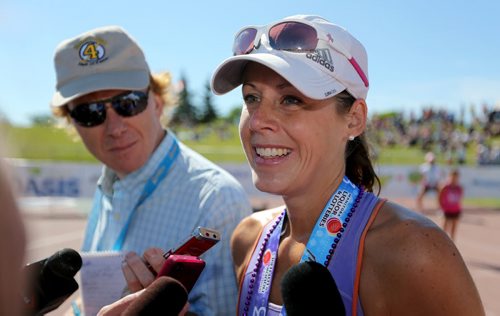 Gina Tranquada, marathon winner, speaking with media shortly after crossing the finish line at the University of Manitoba during the 35th Annual Manitoba Marathon, Sunday, June 16, 2013. (TREVOR HAGAN/WINNIPEG FREE PRESS)