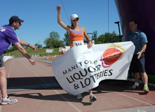 Gina Tranquada wins the women's full race at the 35th Manitoba Marathon, Sunday, June 16, 2013. (TREVOR HAGAN/WINNIPEG FREE PRESS)