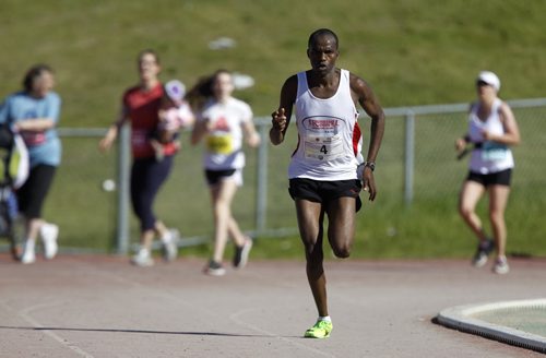 Competing in his first ever full marathon, Evans Maiko, of Kenya, wins the 35th Manitoba Marathon, Sunday, June 16, 2013. (TREVOR HAGAN/WINNIPEG FREE PRESS)