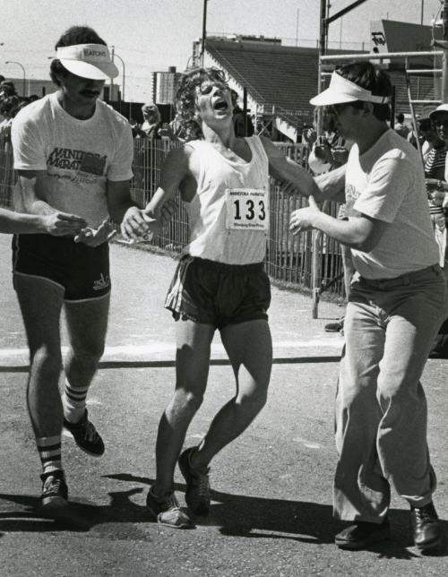 First annual Manitoba Marathon - June 16,  1979 Winnipeg Free Press An exhausted runner is helped to the sidelines.   (Wayne Glowacki/Winnipeg Free Press )