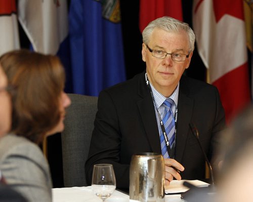 Manitoba Premier Greg Selinger ,listens as (left)  Alberta Premier Alison Redford , speaks at Western Canadian Premiers Conference  opened Monday morning with a photo op , they will discuss the economy , and other issues  such as bullying . Story by  Larry Kusch  KEN GIGLIOTTI / JUNE 7 2013 / WINNIPEG FREE PRESS