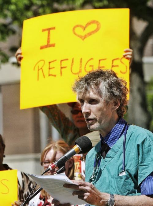 Dr. Michael Dillon, on behalf of Canadian Doctors for Refugee Health Care speaks at a protest at Central Park where local refugees and health care workers gathered to protest federal cuts to refugee health benefits across Canada. 130617 June 17, 2013 Mike Deal / Winnipeg Free Press